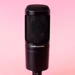 Audio Technica AT20335 microphone on pink backdrop.